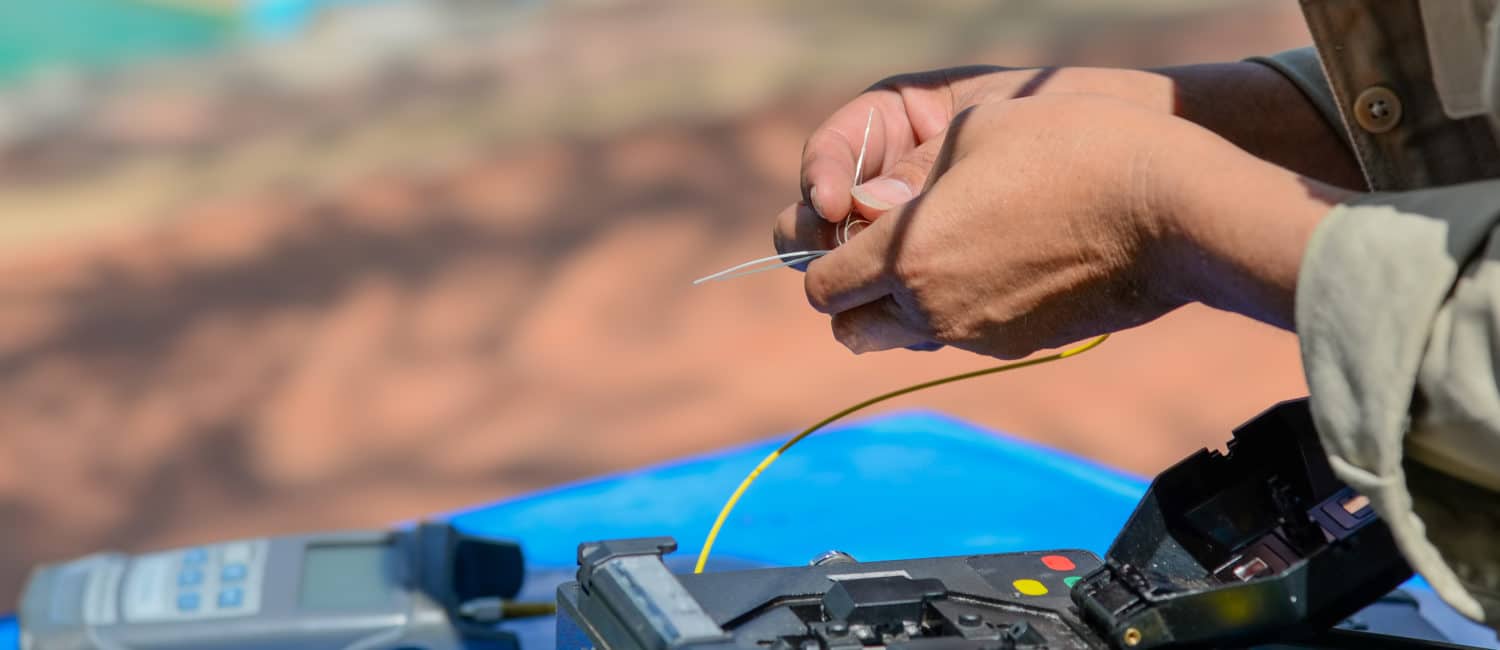 technicians are cutting and fusion fiber optic cables.