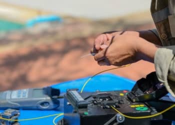 technicians are cutting and fusion fiber optic cables.